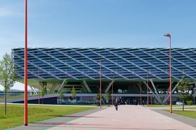 The photo shows the luminaire in a special version with a red coating