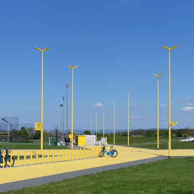 The photo shows the luminaire in a special version with a yellow coating